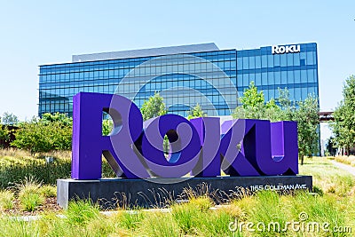 Roku sign, logo at corporate headquarters campus of consumer electronics and broadcast media company in Silicon Valley - San Jose Editorial Stock Photo