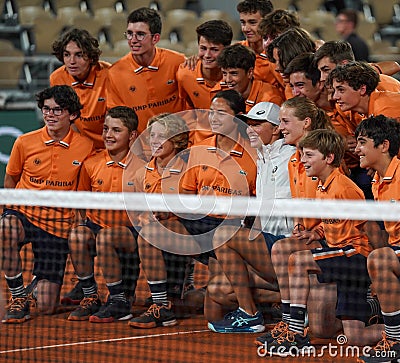 2022 Roland Garros Champion Iga Swiatek of Poland celebrates her victory over Coco Gauff with ball boys at Court Philippe Chatrier Editorial Stock Photo