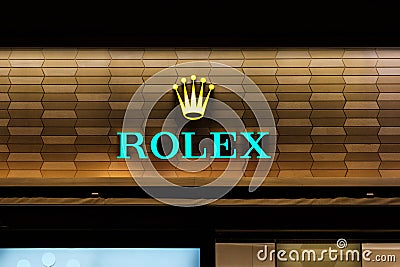 The Rolex logo signage on shop facade in Hongkong Editorial Stock Photo