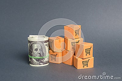 Roll bundle of dollars and cardboard boxes. International trade and trading balance. Global market and business, import and export Stock Photo