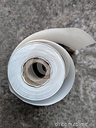 Roll of cash register tape spending money or business concept Stock Photo