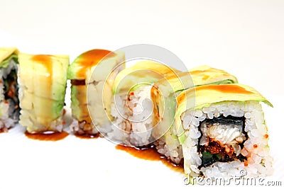 Roll with caviar of salmon. Sushi with caviar of flying fish. Japanese food on a beautiful dish. Stock Photo