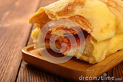 Roll with egg & shredded pork and barbeque pork with some bites close up Stock Photo