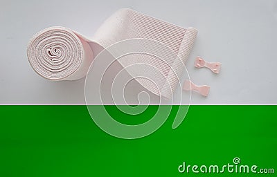 Roll elastic bandage or gauze with green copy space Stock Photo