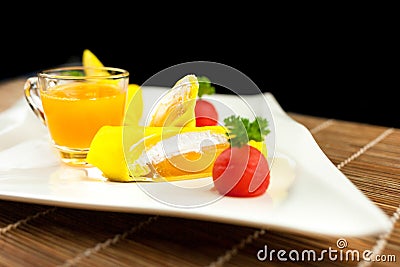 Roll pancake mango with mango juice on black background Stock Photo