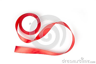 Roll of red ribbon on the white background. Stock Photo