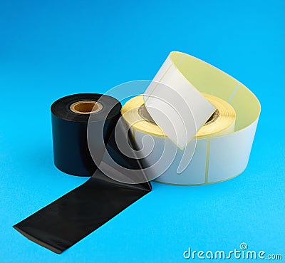 Roll of self-adhesive stickers and Tape for thermal transfer printing. Ribbon thermal transfer tape TTR Stock Photo