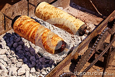 Rolled bakery meat rolls in charcoal Stock Photo