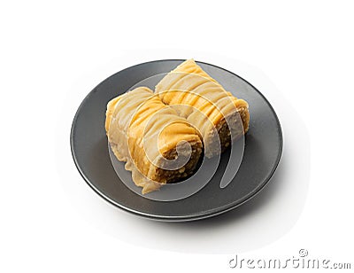 Rolled Baklava Isolated, Ramadan Dessert Roll on Restaurant Plate, Eastern Sweet Pastries Stock Photo