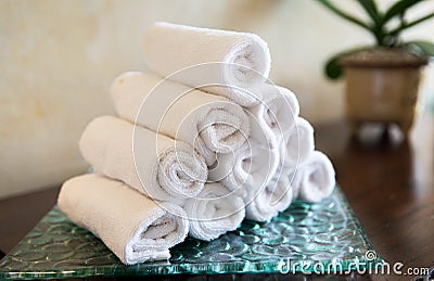 Rolled bath towels at hotel spa Stock Photo