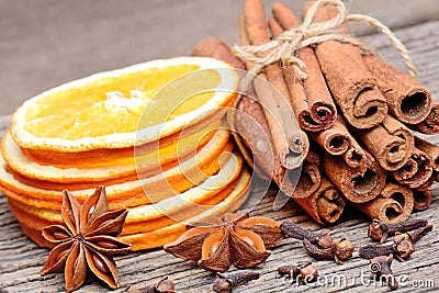 Rolled of cinnamon sticks with sliced of dried orange clove and Stock Photo