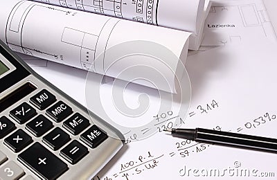 Rolled electrical diagrams, calculator and mathematical calculations Stock Photo