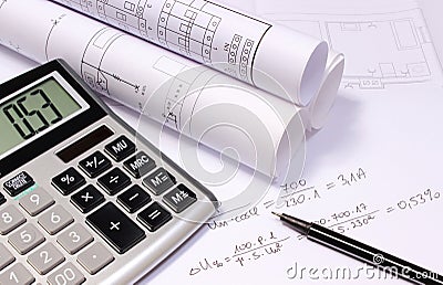 Rolled electrical diagrams, calculator and mathematical calculations Stock Photo