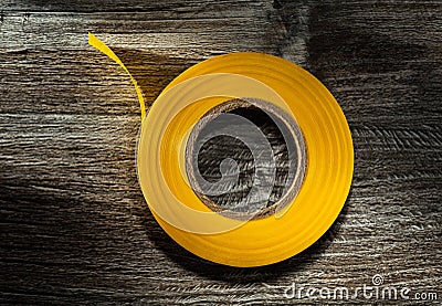 Rolled electrical tape on vintage wooden board Stock Photo
