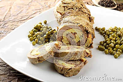 Rolled meat stuffed with omelette Stock Photo