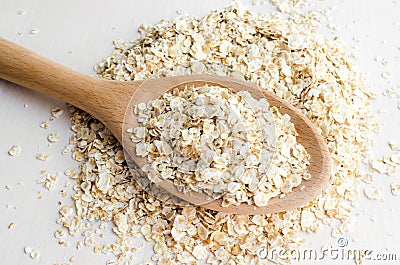 Rolled oats in big spoon Stock Photo