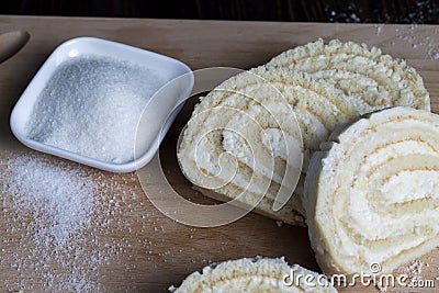 a rolled roll of soft cake and sweet curd filling Stock Photo