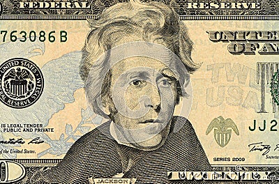 A rolled up American twenty dollar bill Stock Photo