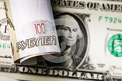 Rolled up one hundred rubles of the Russian Federation, lying on the dollar Stock Photo