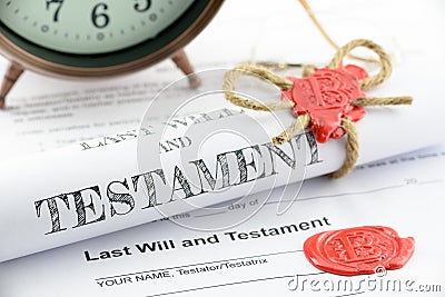 Rolled up scroll of last will and testament fastened with natural brown jute twine hemp rope. Stock Photo