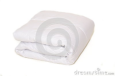 Rolled white duvet cover on isolated background Stock Photo