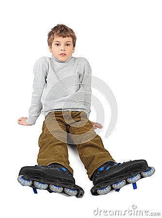 Roller boy sitting and looking at camera Stock Photo