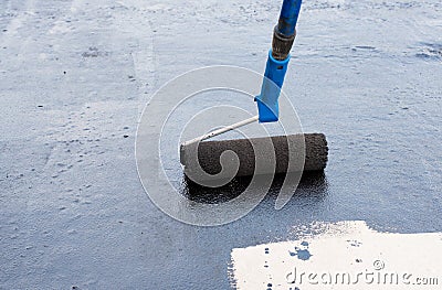 Roller brush waterproofing Stock Photo