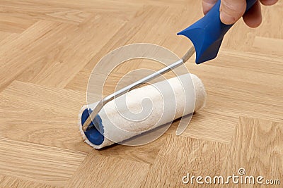 Roller for floor varnish Stock Photo