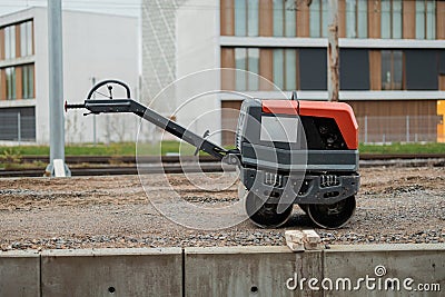 Roller while renovating the historical train station of Ljubljana Siska, making temporary platforms next to the railway track, Stock Photo