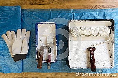 Rollers of different sizes,brush and gloves for painting the walls and ceiling. Painting tools Stock Photo