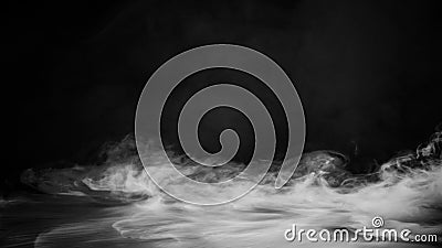 Rolling billows of smoke mist clouds from dry ice across the bottom light . Fog on floor isolated background black texture . Stock Photo