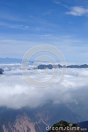 Rolling clouds and mountain summits andscape Stock Photo