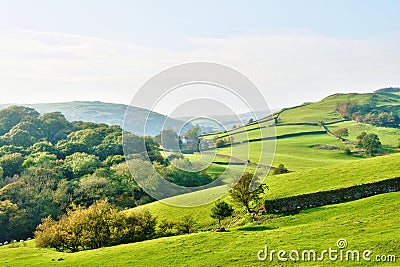 Rolling countryside around a farm Stock Photo