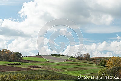 Rolling green hills cloud landscape with copy room Stock Photo