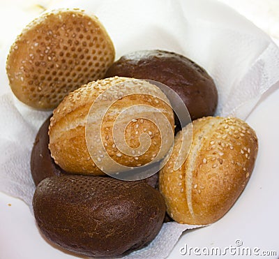 Rolls black and white bread on a white plate Stock Photo