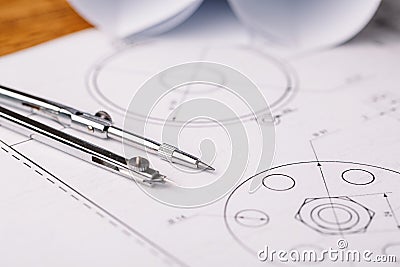 Rolls of blueprints, drawing compass and graphical architectural Stock Photo