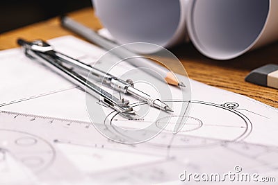 Rolls of blueprints, drawing compass and graphical architectural Stock Photo