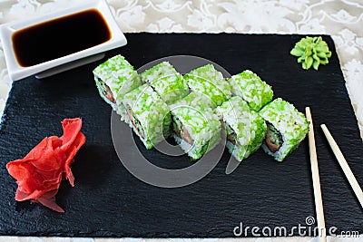 Rolls California Green on a black plate. Stock Photo