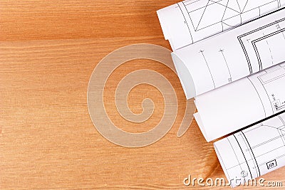 Rolls of electrical blueprints for engineer jobs, copy space for text on board Stock Photo