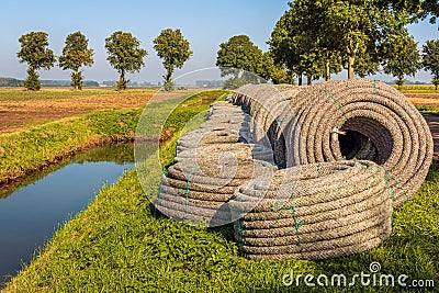 Rolls of new permeable pipes for the construction of a subsurface drainage system Stock Photo