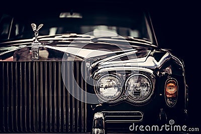 Rolls-Royce - classic British car on black background, close-up. Editorial Stock Photo