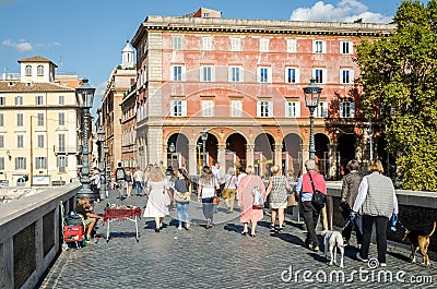 Roma, Italy - October 2015: Tourists walk over bridges and streets of ancient Rome on a sunny autumn day Editorial Stock Photo