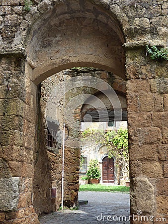 Roman arches leading to a wood door Stock Photo