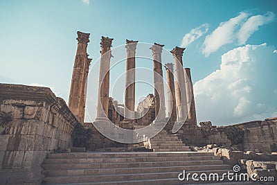 Roman architecture. old historic district of Jarash. High beautiful antique columns against the blue sky. Temple of Artemis in the Stock Photo