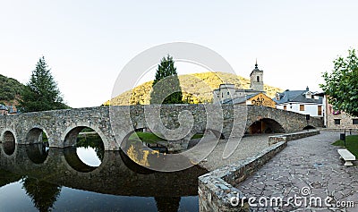 Roman bridge and Church of San Nicola da Bari, Molinaseca Editorial Stock Photo