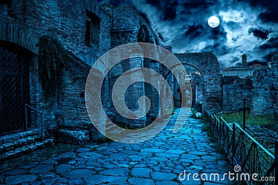 Roman Forum at night, Rome, Italy. Mystery creepy view of Ancient street in full moon Stock Photo