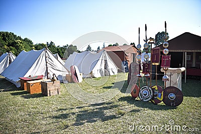 Roman legionary camp with tent, shields, helmets and army insignia Editorial Stock Photo