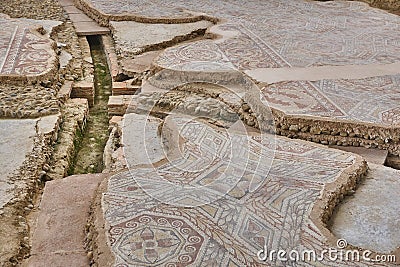 Roman mosaic tiles and hypocaust in La Olmeda village. Spain Stock Photo