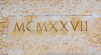 Roman numerals equaling 1927 carved into the wall of the Santa Barbara California county courthouse Editorial Stock Photo