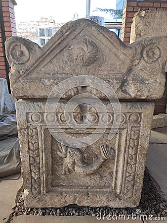 Roman sarcophagus Sremska Mitrovica with carved fish Editorial Stock Photo